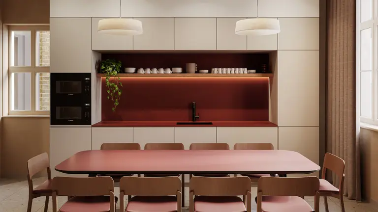 A kitchen with a table and chairs