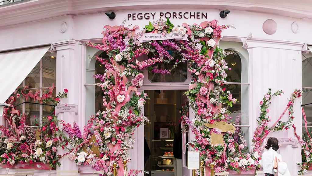 Outside of Peggy Porschen with a floral archway
