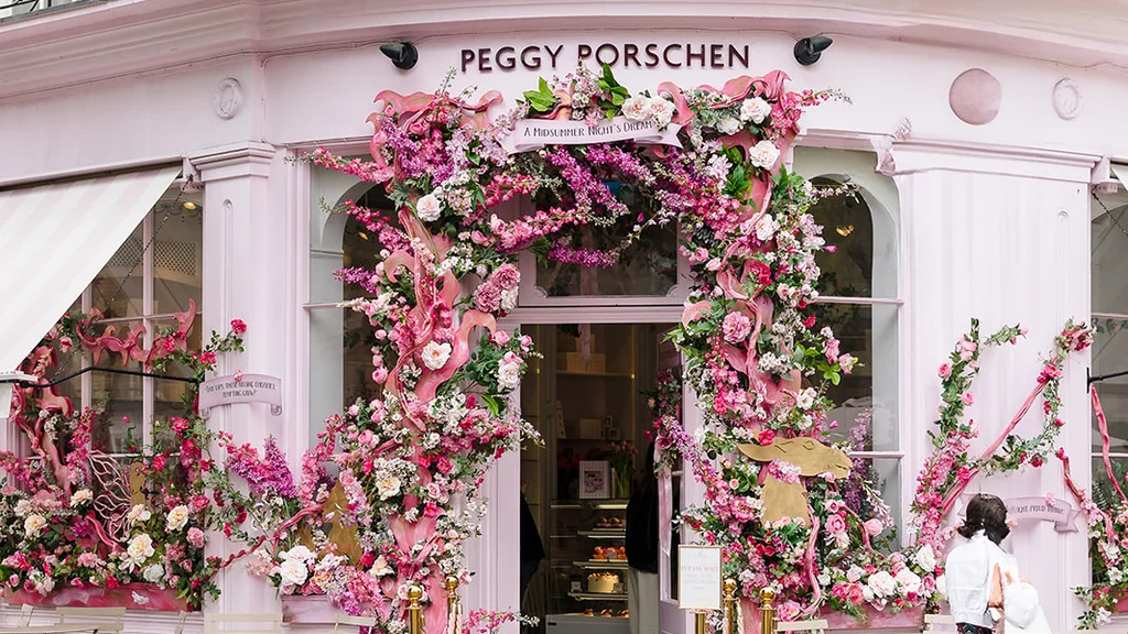 Outside of Peggy Porschen with a floral archway