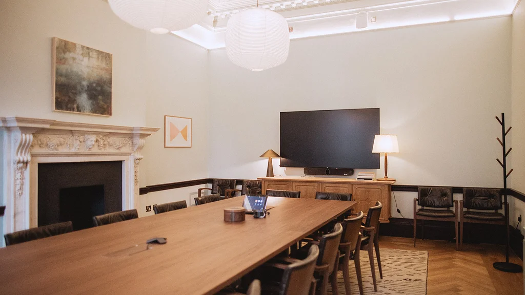 Meeting room with table, chairs and AV equipment