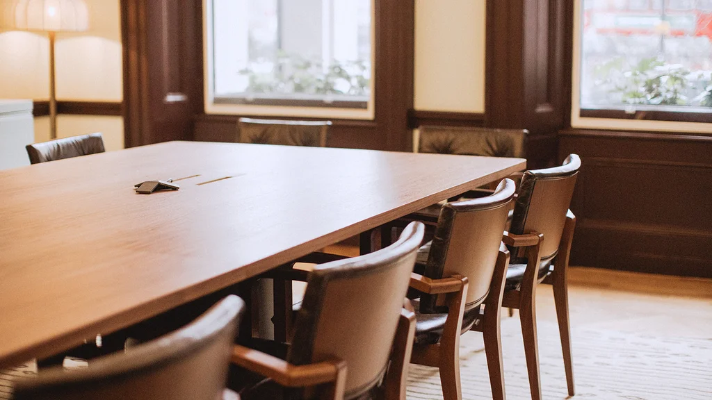 Internal photograph of meeting room table and chairs
