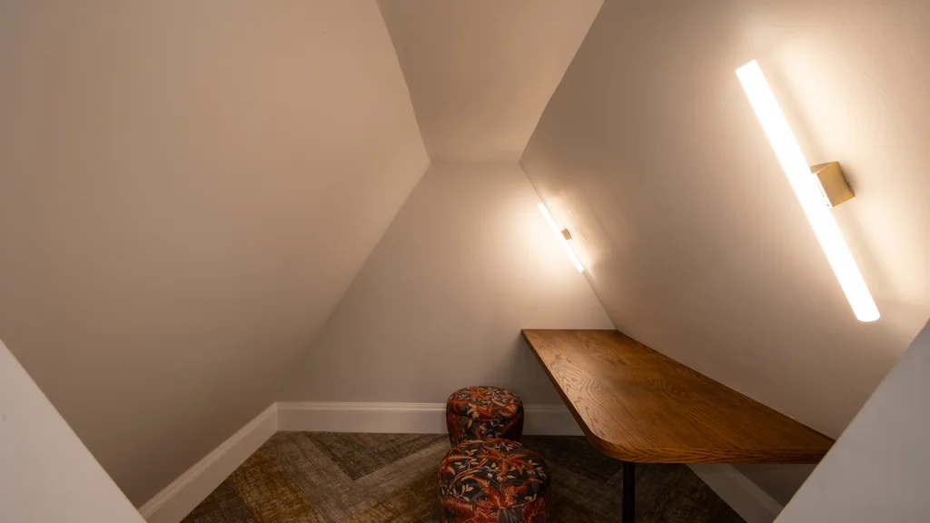 A desk and chair in a cosy nook