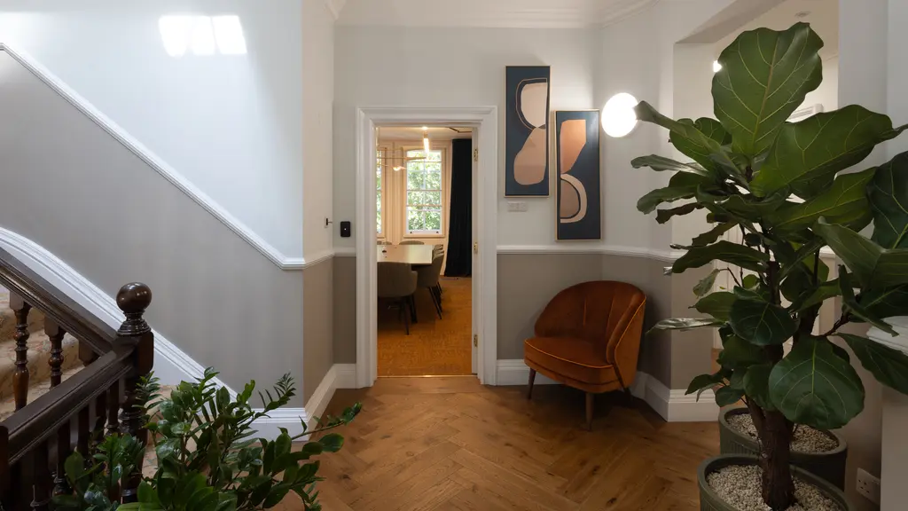 Hallway with a plant and a chair