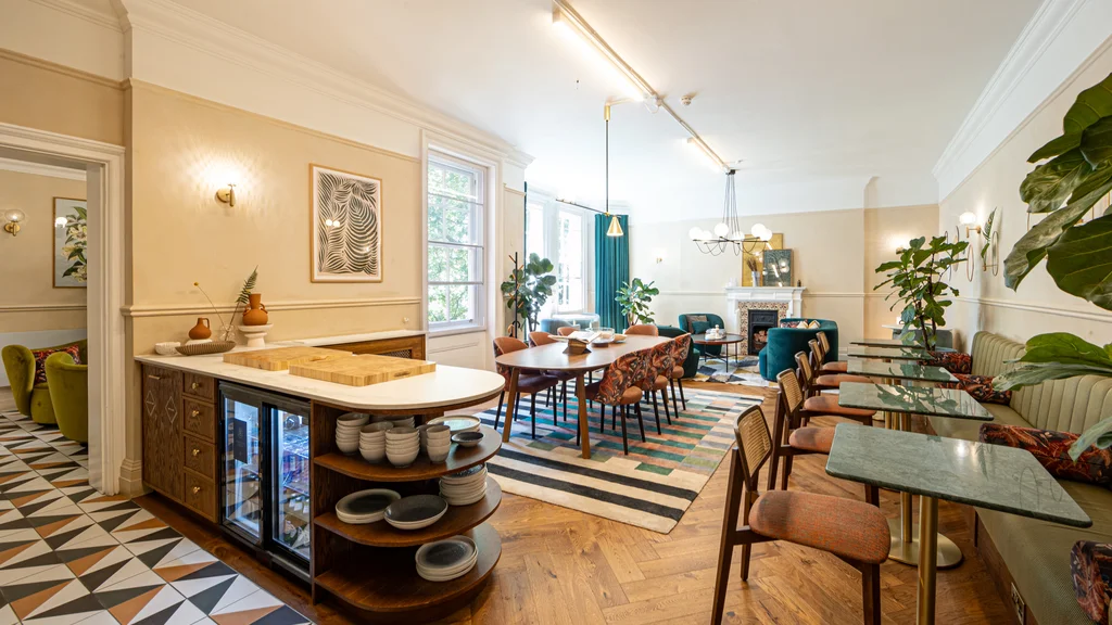 A communal area with tables and chairs
