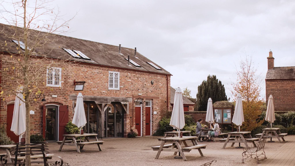 Exterior of shop and cafe with picnic tables