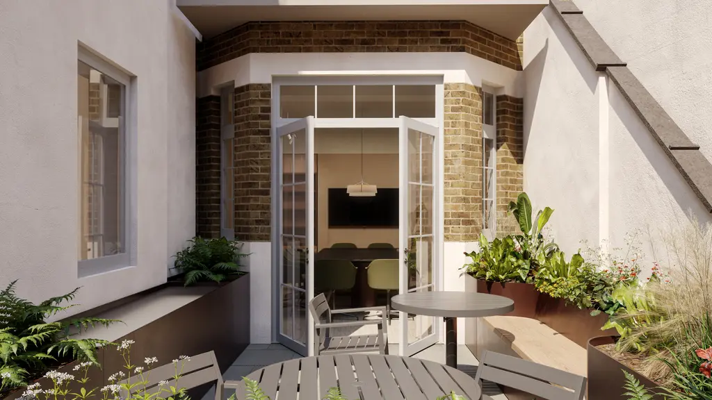 Outside area with chairs and a table