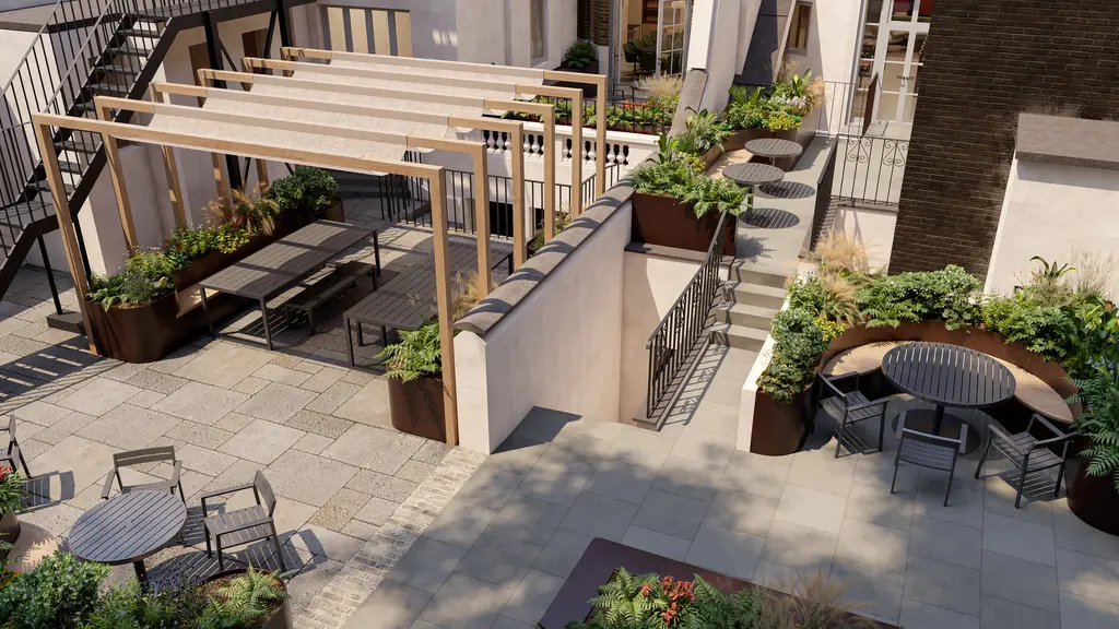 Garden area with plants and a table and chairs