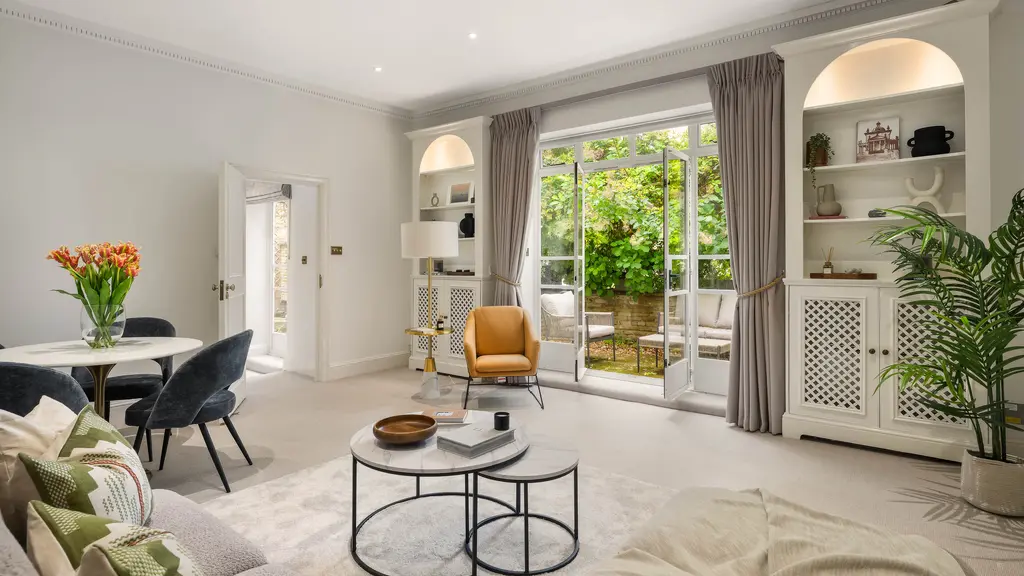 Living room with doors open to garden