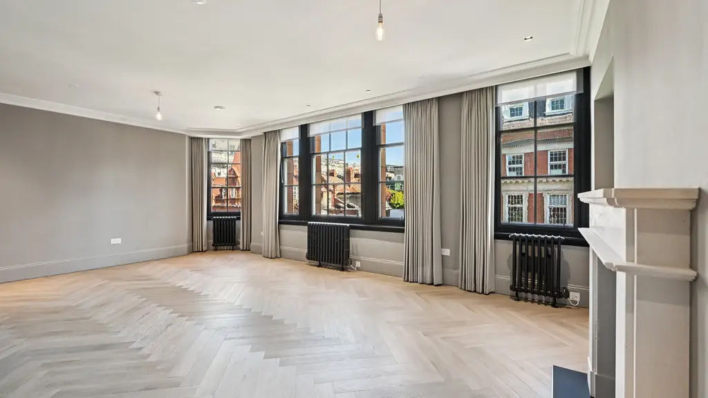 Large empty room with large windows