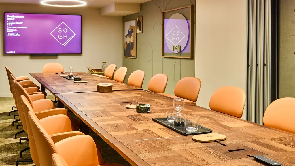 A meeting room with a long table