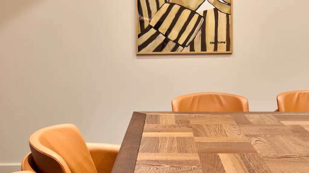A meeting room with artwork on the walls
