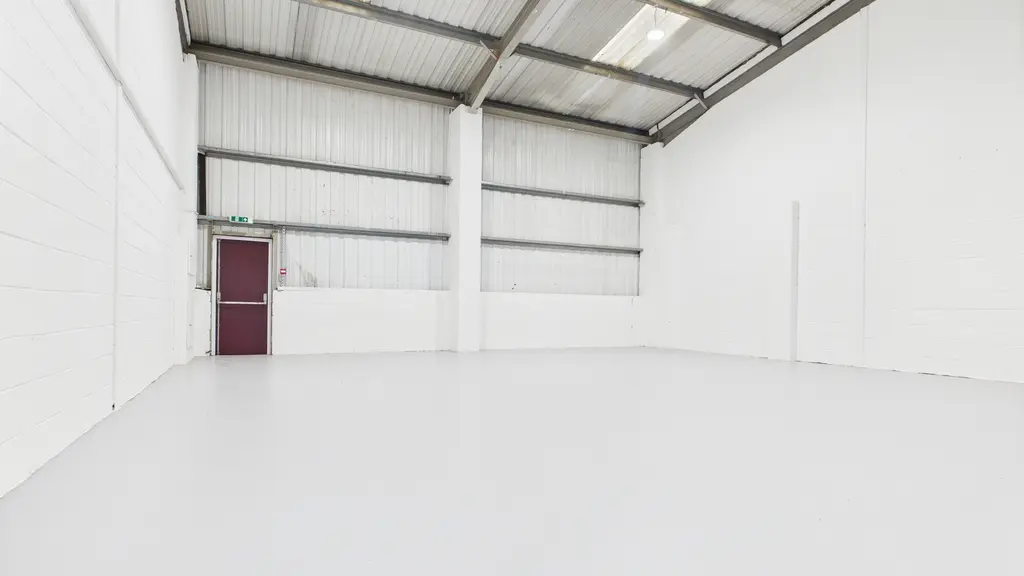 Inside a large white warehouse