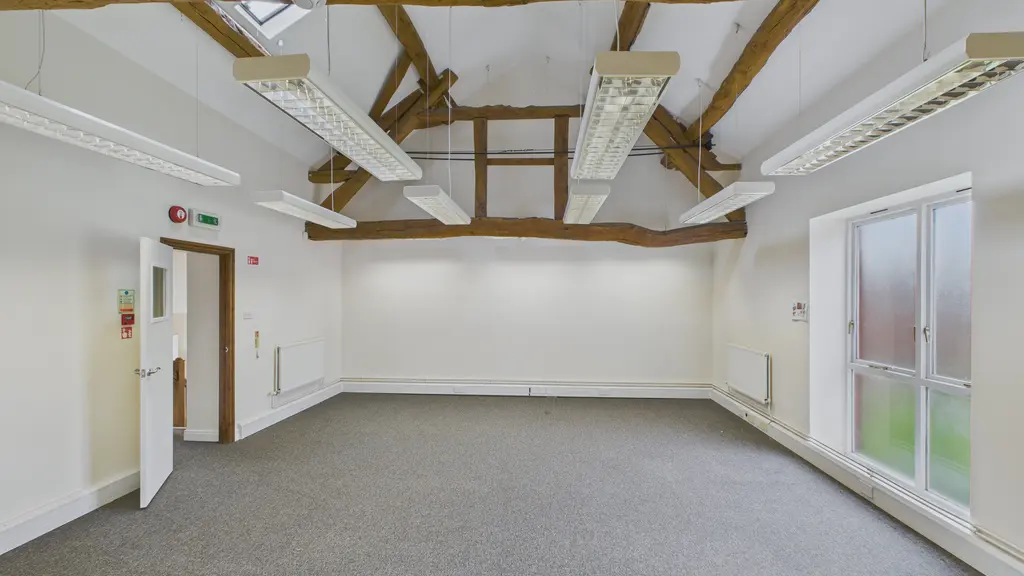 Empty room with ceiling beams
