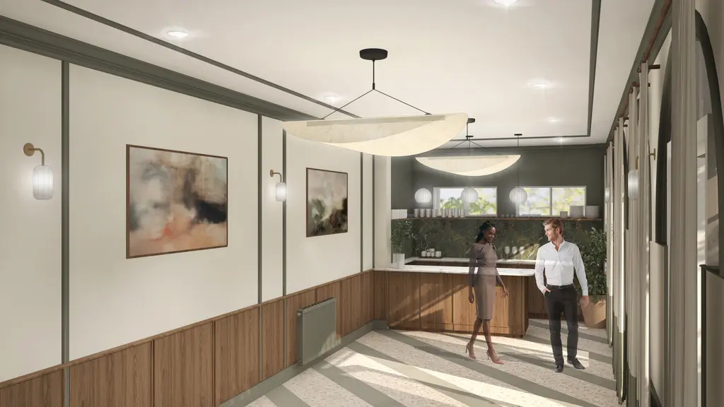 An empty room with two people walking around it 