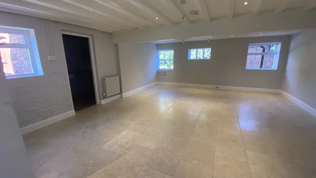 Large room with a black door