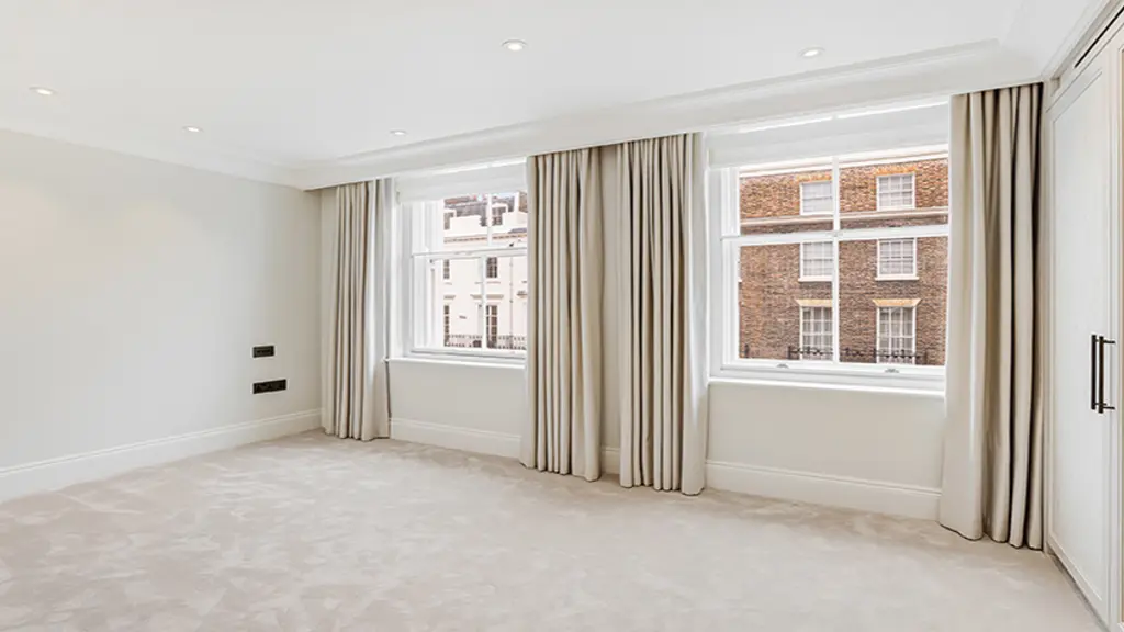 Empty room with two windows 
