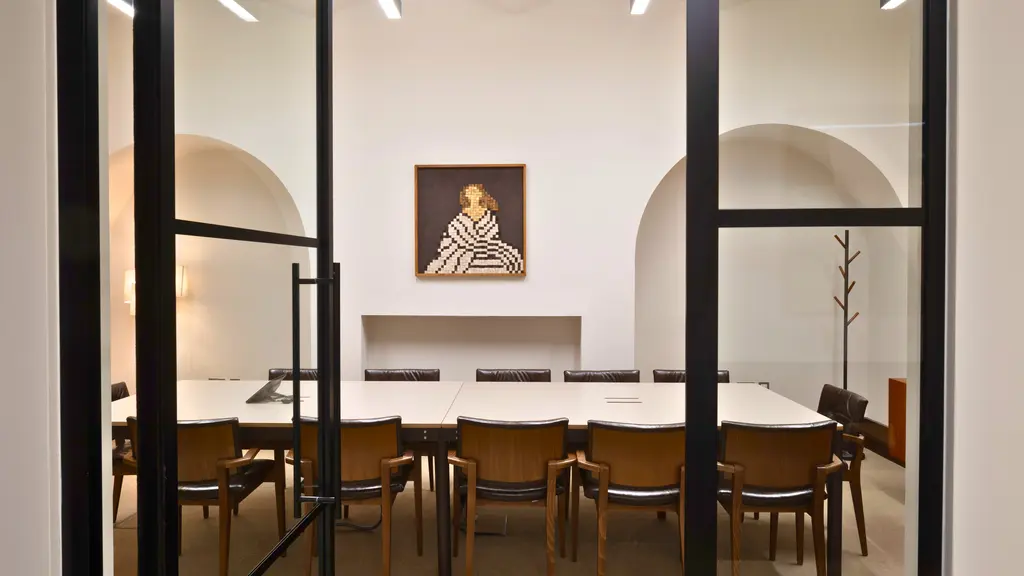 Meeting room with a large table and chairs 