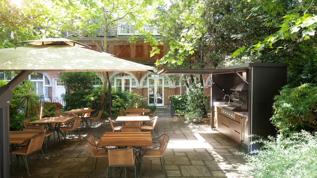 Barbecue with tables and chairs 