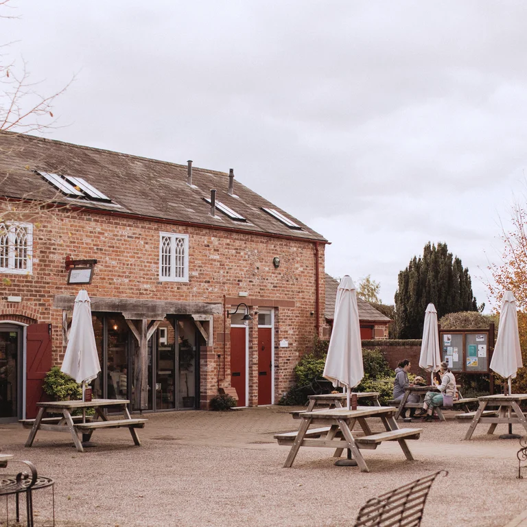 Exterior of shop and cafe with picnic tables